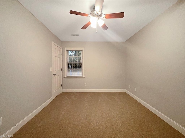 empty room featuring ceiling fan and carpet floors