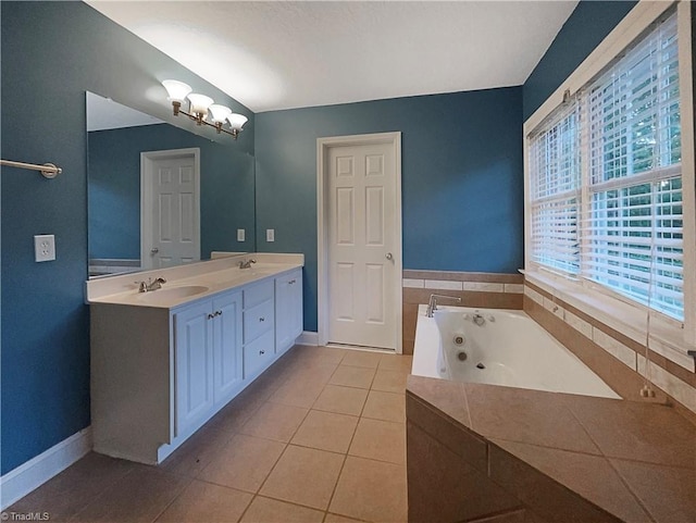 bathroom featuring vanity, a relaxing tiled tub, and tile patterned flooring