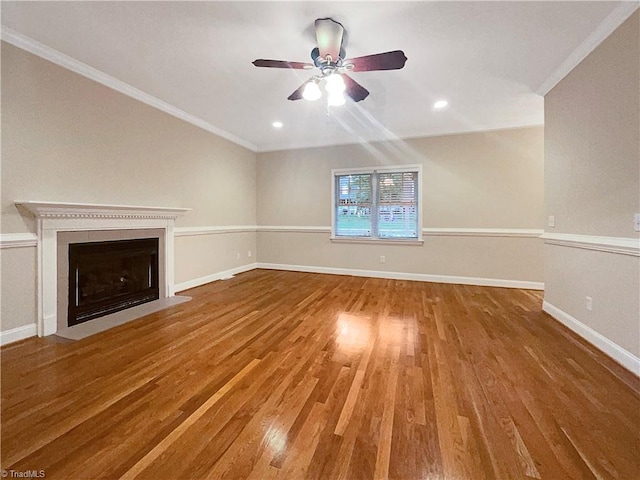 unfurnished living room with crown molding, wood-type flooring, and ceiling fan