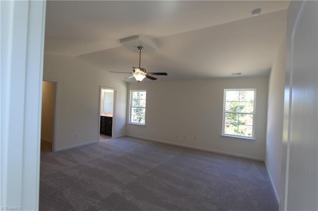 spare room featuring ceiling fan and carpet floors