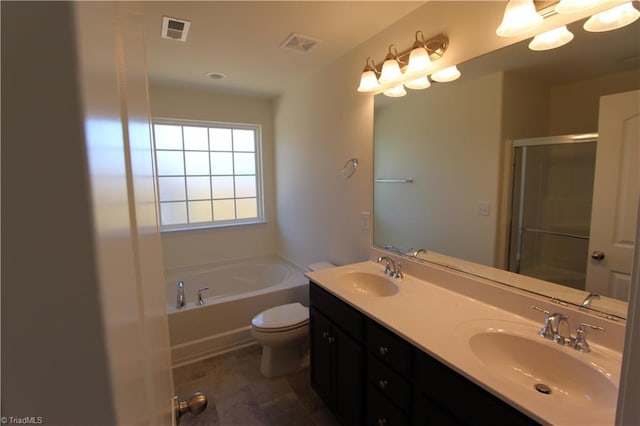 bathroom with tile patterned flooring, a bathing tub, double sink vanity, and toilet