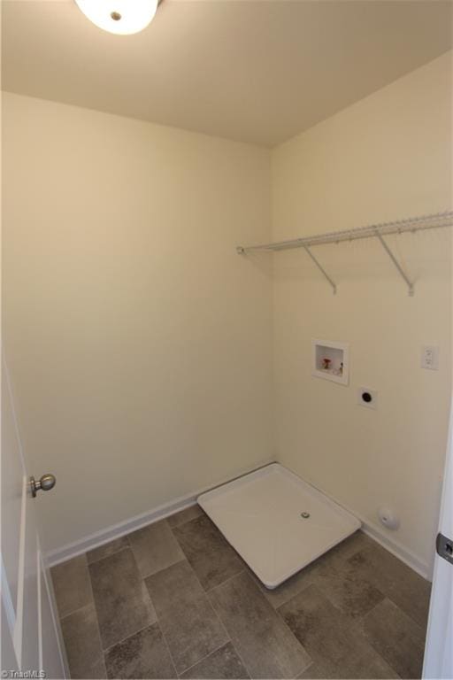 clothes washing area with tile patterned flooring, washer hookup, and hookup for an electric dryer