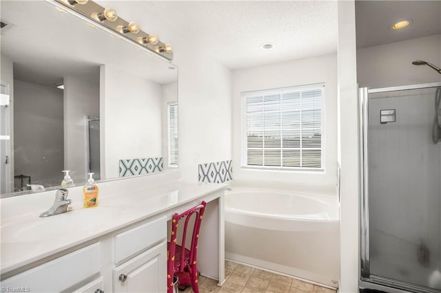 bathroom featuring vanity and plus walk in shower