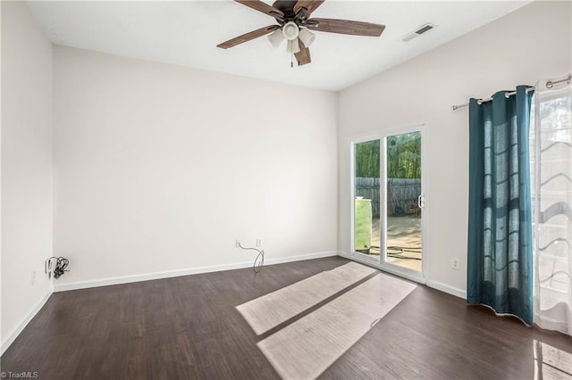 empty room featuring ceiling fan and dark hardwood / wood-style floors