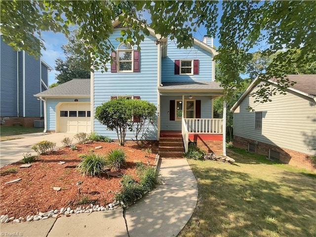 view of front of house featuring covered porch, a front yard, and a garage