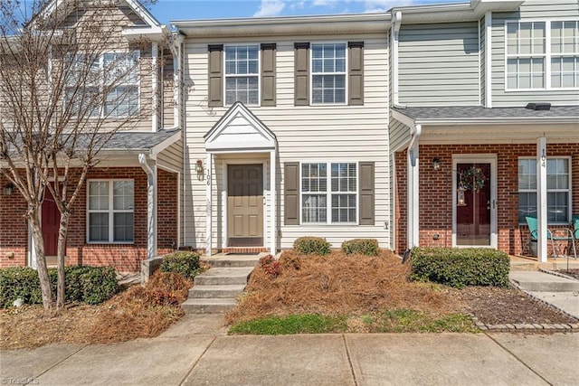 multi unit property featuring brick siding