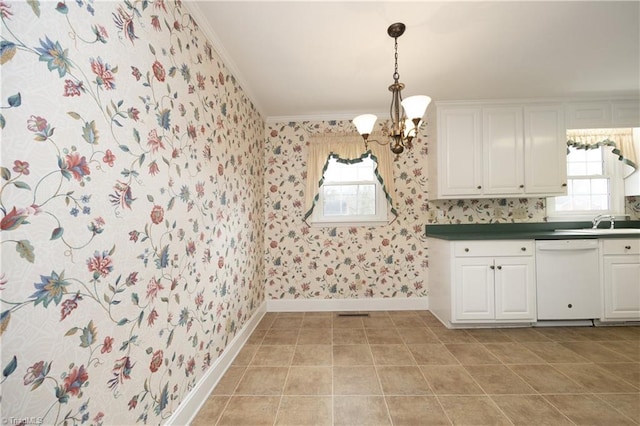 kitchen with crown molding, white cabinetry, decorative light fixtures, dishwasher, and a notable chandelier