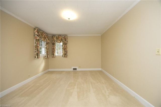 unfurnished room with ornamental molding and light colored carpet