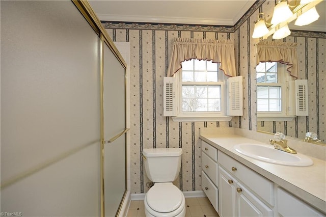 bathroom with crown molding, vanity, a shower with shower door, tile patterned floors, and toilet