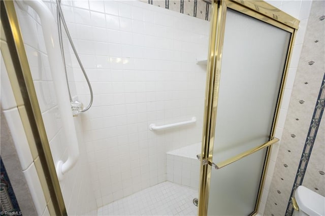 bathroom with toilet and walk in shower