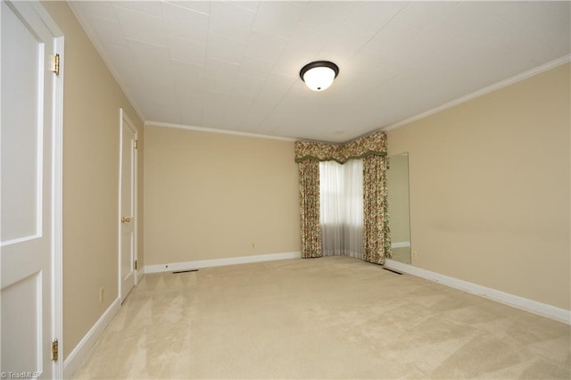 unfurnished bedroom with ornamental molding and light carpet