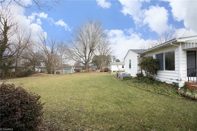 view of yard with central AC unit