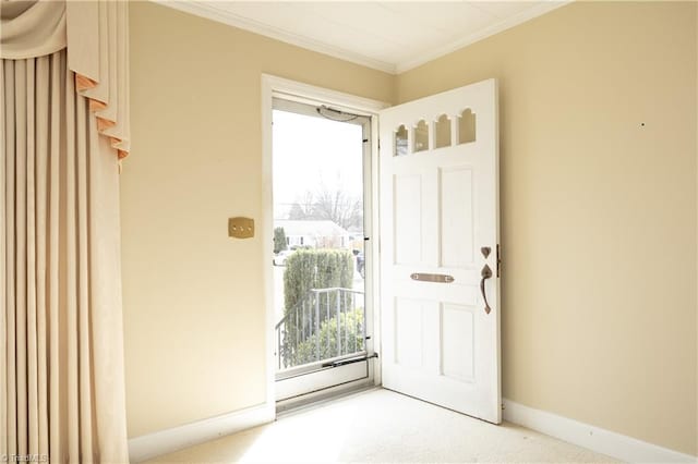 entryway featuring crown molding and carpet