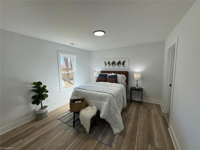 bedroom featuring hardwood / wood-style floors