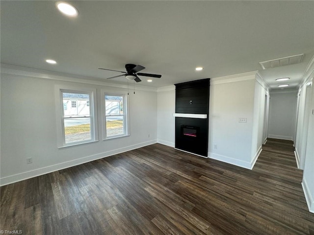 unfurnished living room featuring ceiling fan, a fireplace, crown molding, and dark wood-type flooring