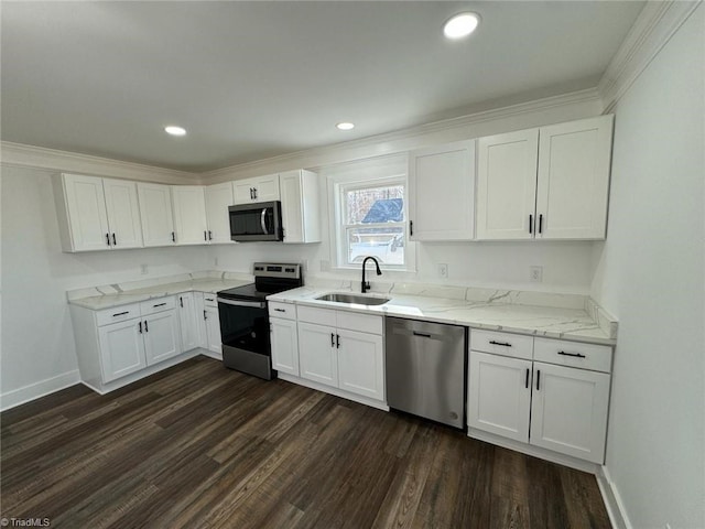 kitchen with sink, white cabinets, appliances with stainless steel finishes, and dark hardwood / wood-style flooring