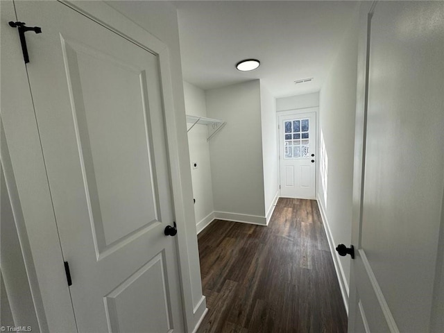 clothes washing area featuring dark hardwood / wood-style floors