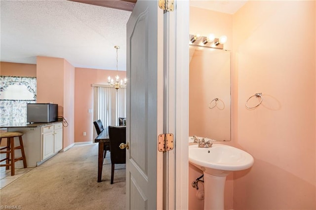 3902 Elizabeth Glen Way, Jamestown, NC 27282 - bathroom with a chandelier