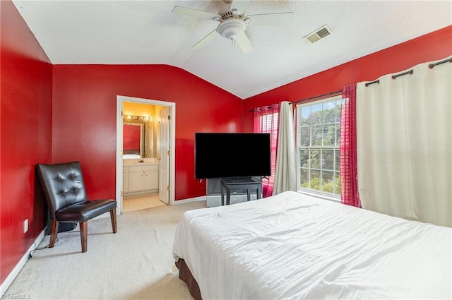 3902 Elizabeth Glen Way, Jamestown, NC 27282 - bedroom with lofted ceiling, carpet floors, baseboards, ceiling fan, and connected bathroom