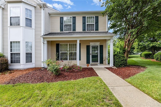 3902 Elizabeth Glen Way, Jamestown, NC 27282 - view of front facade with a front yard and covered porch