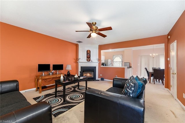 3902 Elizabeth Glen Way, Jamestown, NC 27282 - living area with light carpet, a chandelier, a large fireplace, and ceiling fan