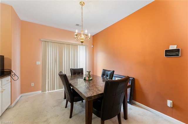 3902 Elizabeth Glen Way, Jamestown, NC 27282 - dining area with a chandelier, light colored carpet, and baseboards