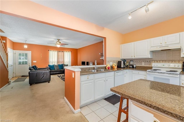3902 Elizabeth Glen Way, Jamestown, NC 27282 - kitchen featuring white appliances, a sink, under cabinet range hood, white cabinets, and tasteful backsplash