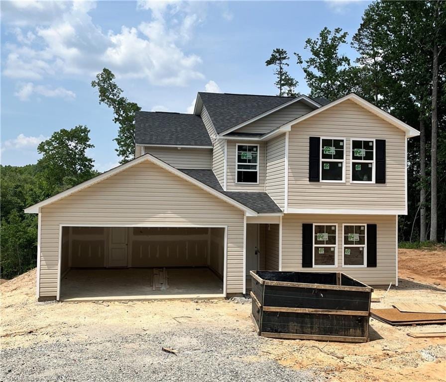 373 Aztec Dr, Winston-Salem, NC 27107 - view of front facade featuring roof with shingles and a garage