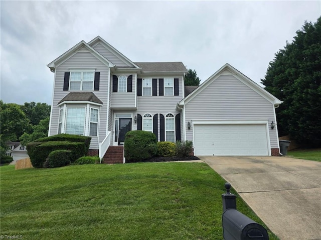 4803 Tenby Dr, Greensboro, NC 27455 - view of front of property featuring concrete driveway, an attached garage, and a front lawn