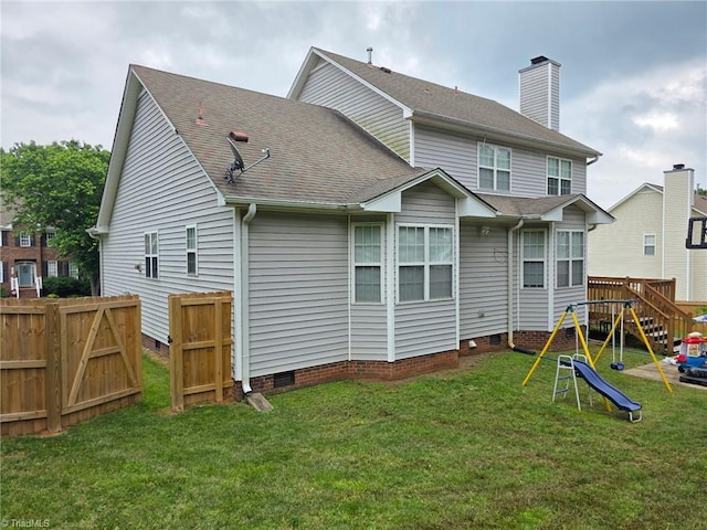 4803 Tenby Dr, Greensboro, NC 27455 - back of property featuring crawl space, a playground, and a shingled roof