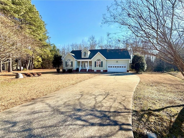 cape cod house with a garage