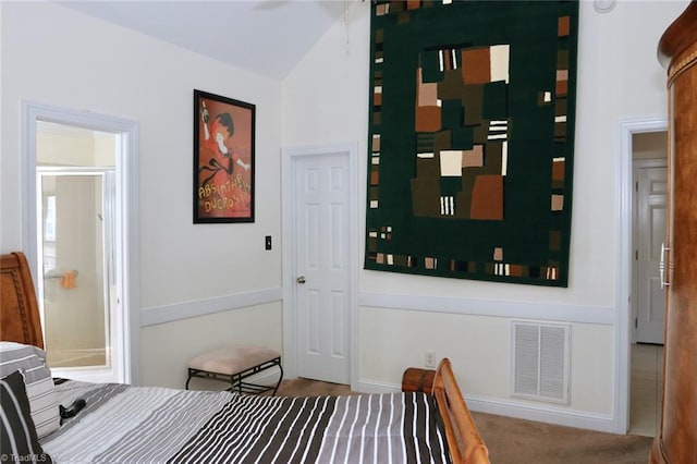 carpeted bedroom with lofted ceiling