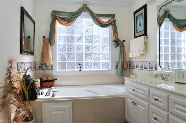 bathroom with vanity, tiled tub, and ornamental molding