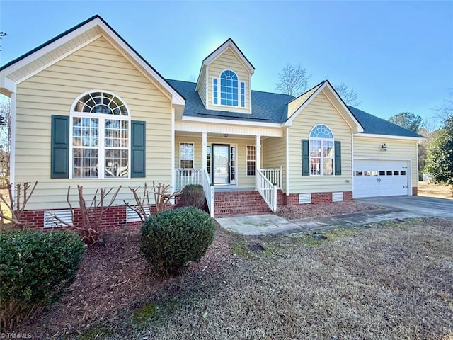 view of front facade with a porch and a garage