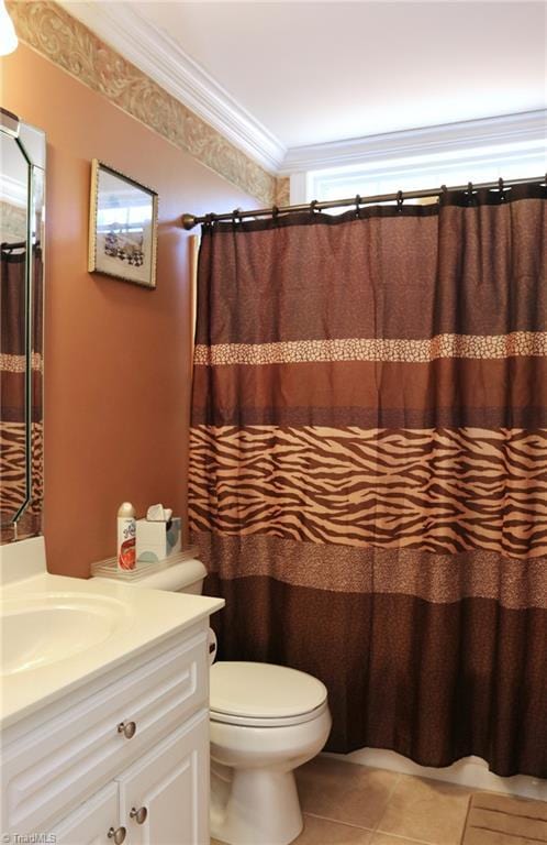 bathroom with toilet, crown molding, tile patterned floors, vanity, and a shower with curtain