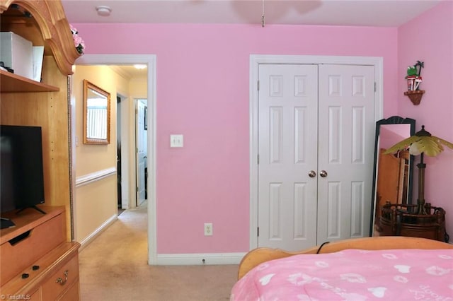 carpeted bedroom with a closet