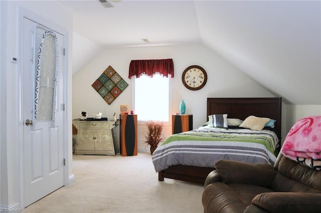 bedroom featuring light carpet and lofted ceiling