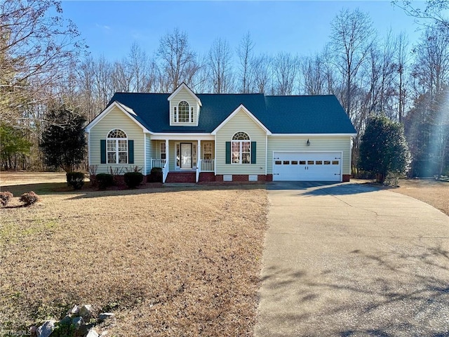 view of front facade featuring a garage, a front lawn, and covered porch