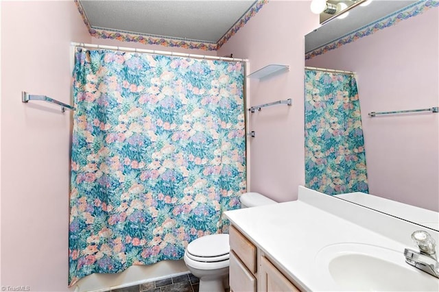 bathroom featuring vanity, curtained shower, and toilet