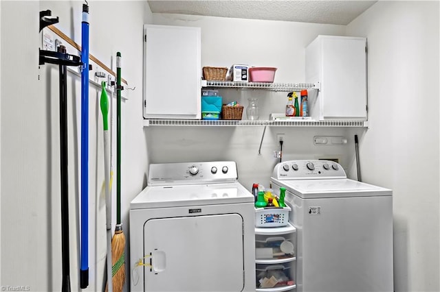 washroom featuring separate washer and dryer and cabinets