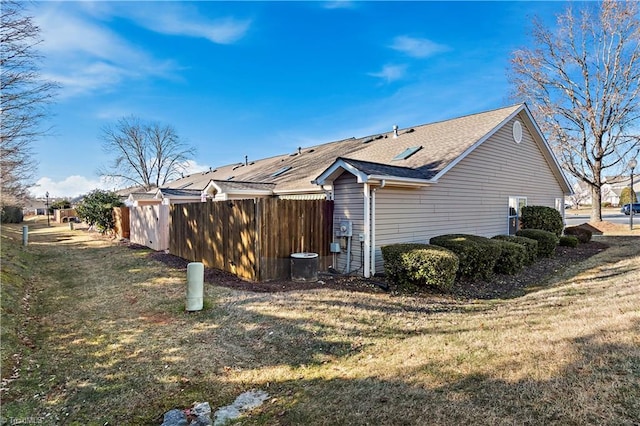 view of side of property with a yard