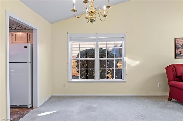 interior space featuring lofted ceiling, carpet floors, and a notable chandelier