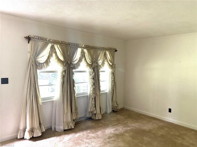437 Charles Dr, Winston-Salem, NC 27107 - carpeted empty room with a textured ceiling and baseboards