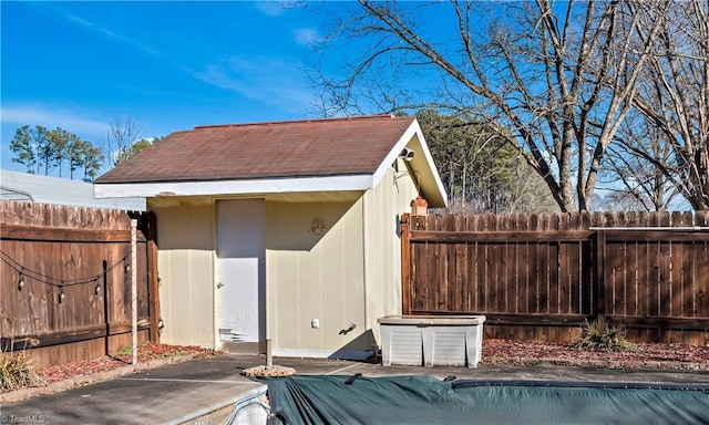 view of outbuilding with a covered pool