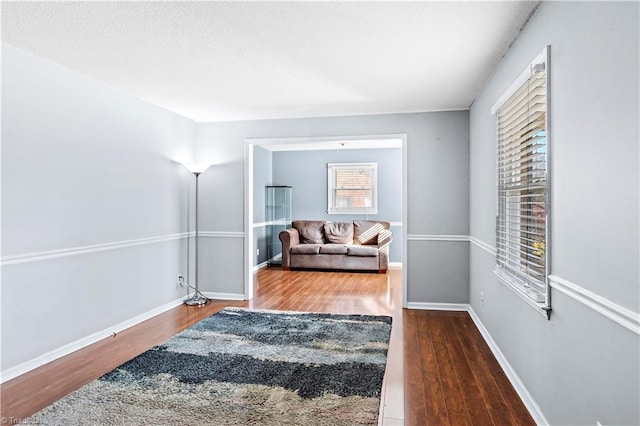 sitting room with dark hardwood / wood-style floors