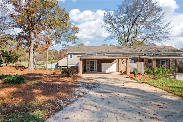 back of property featuring a carport