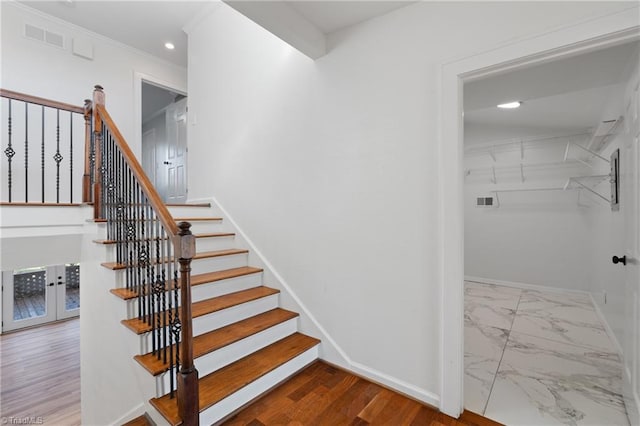 stairs featuring hardwood / wood-style flooring