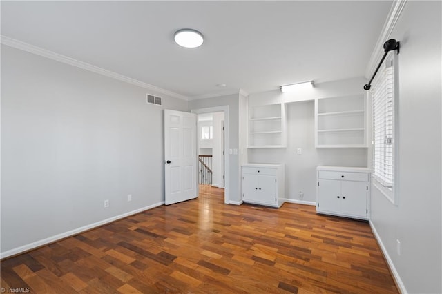 unfurnished bedroom with hardwood / wood-style floors and ornamental molding