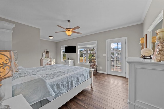 bedroom with ceiling fan, dark wood-type flooring, crown molding, and access to exterior