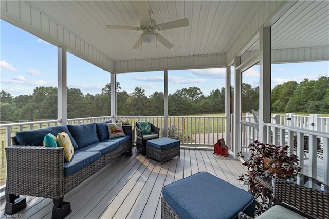 deck with an outdoor living space and ceiling fan